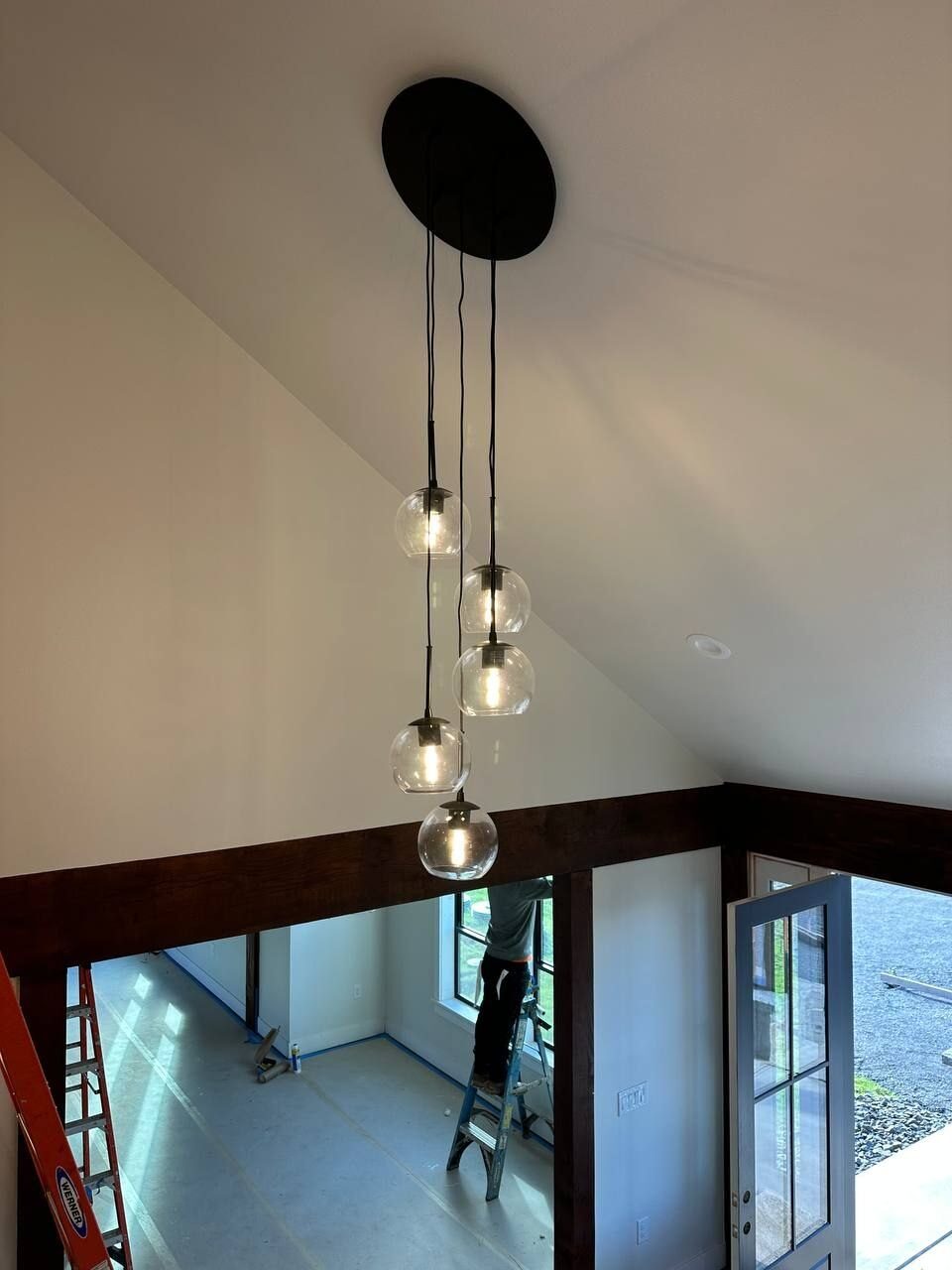 Cluster of glass globe pendants over a stairwell in a Vancouver WA home