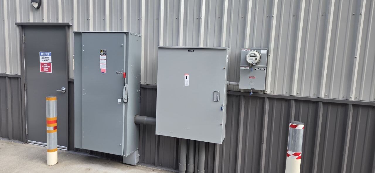 Commercial disconnects and service gear mounted on a metal building in Clark County WA